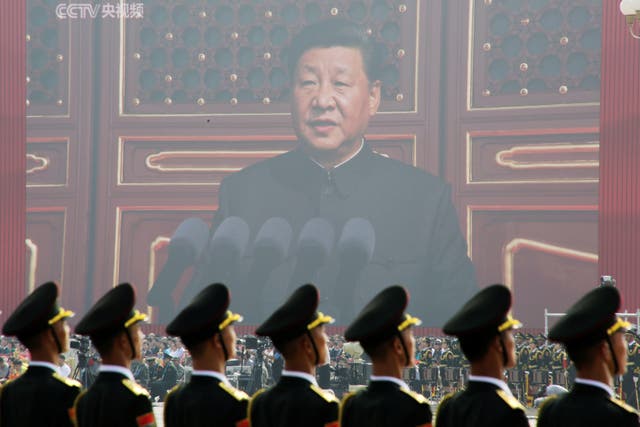 <p>Soldiers of People's Liberation Army (PLA) are seen before a giant screen as Chinese President Xi Jinping speaks at the military parade marking the 70th founding anniversary of People's Republic of China, on its National Day in Beijing, China October 1, 2019</p>