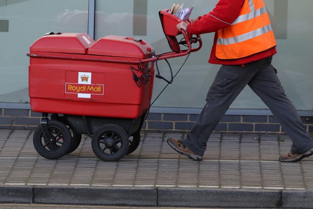 Royal Mail slumped to a full-year loss of more than £1 billion (PA)