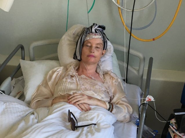 Lauren Harries in hospital following brain surgery