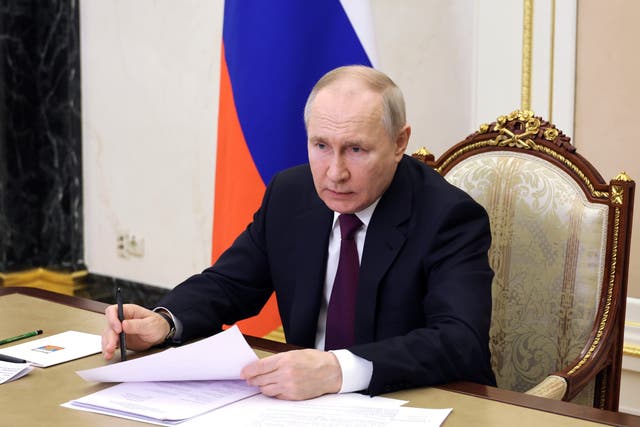 <p>Russian president Vladimir Putin chairs a meeting with members of his government via video link </p>
