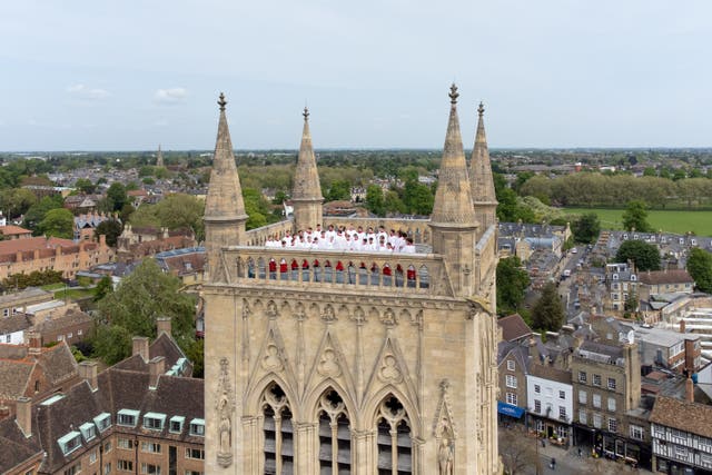 <p>The Choir of St John’s College at the University of Cambridge perform the Ascension Day carol from the top of a tower, a custom dating back to 1902 (Joe Giddens/ PA)</p>