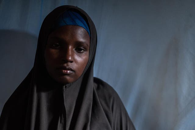 <p>Mother-of-three Naima* was photographed sitting with her baby daughter Najma* in a stabilisation centre in Baidoa</p>