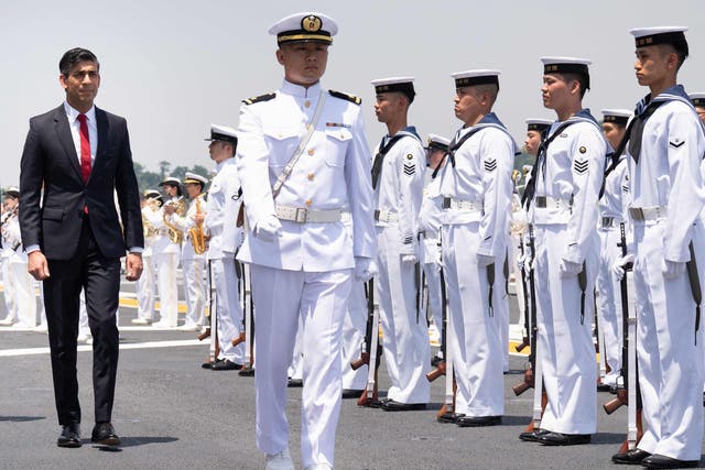 <p>Rishi Sunak inspects the guard of honour on Japanese aircraft carrier JS Izumo</p>