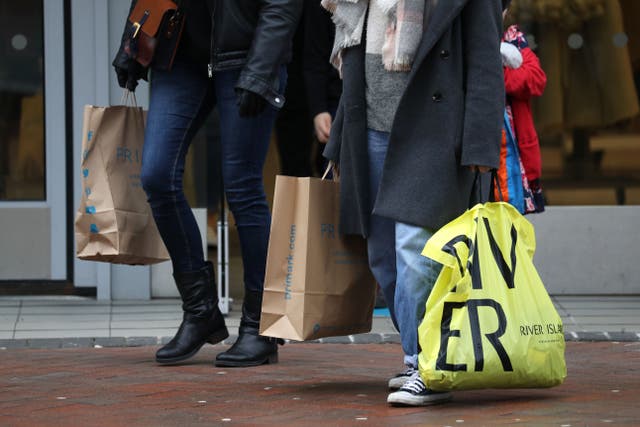 Consumer confidence in the year ahead is continuing to recover despite persistent cost-of-living pressures, a survey suggests (PA)