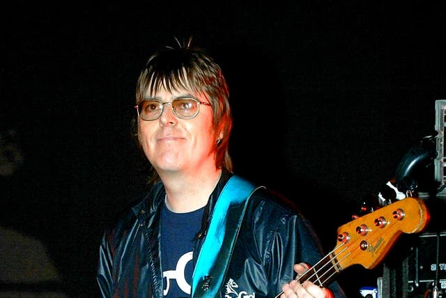 Andy Rourke on stage with Badly Drawn Boy during the Manchester Versus Cancer charity concert in 2006 (PA)