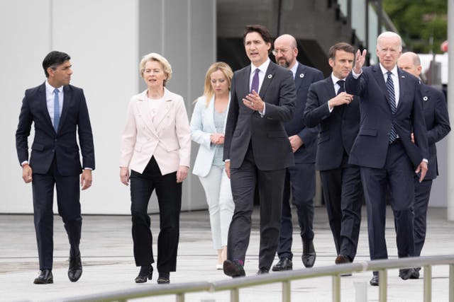<p>Britain’s Prime Minister Rishi Sunak, European Commission President Ursula von der Leyen, Italy’s Prime Minister Giorgia Meloni, Canada’s Prime Minister Justin Trudeau, President of the European Council Charles Michel, France’s President Emmanuel Macron, US President Joe Biden and Germany’s Chancellor Olaf Scholz walk in the Peace Memorial Park as part of the G7 Leaders’ Summit in Hiroshima</p>