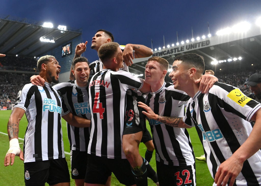 <p>Bruno Guimaraes is held aloft by teammates after scoring Newcastle’s fourth against Brighton on Thursday </p>