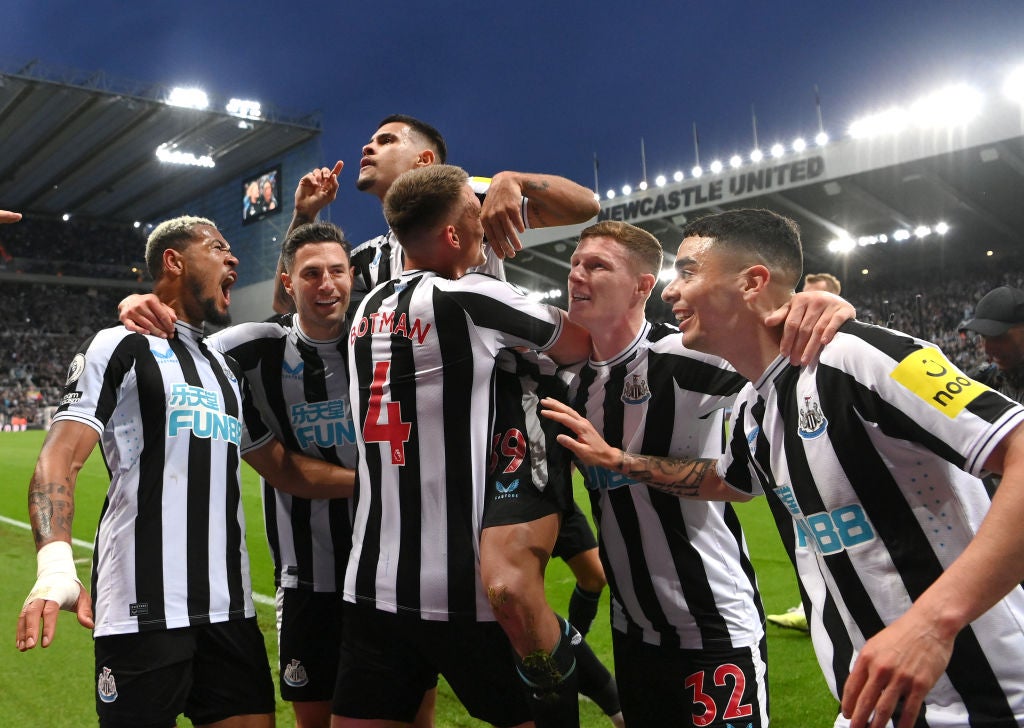 Bruno Guimaraes is held aloft by teammates after scoring Newcastle’s fourth against Brighton on Thursday