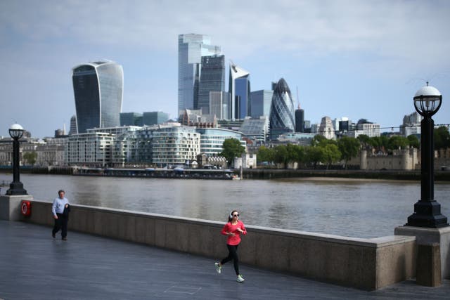 A jogger runs along the Thames Path (Yui MOk/PA)