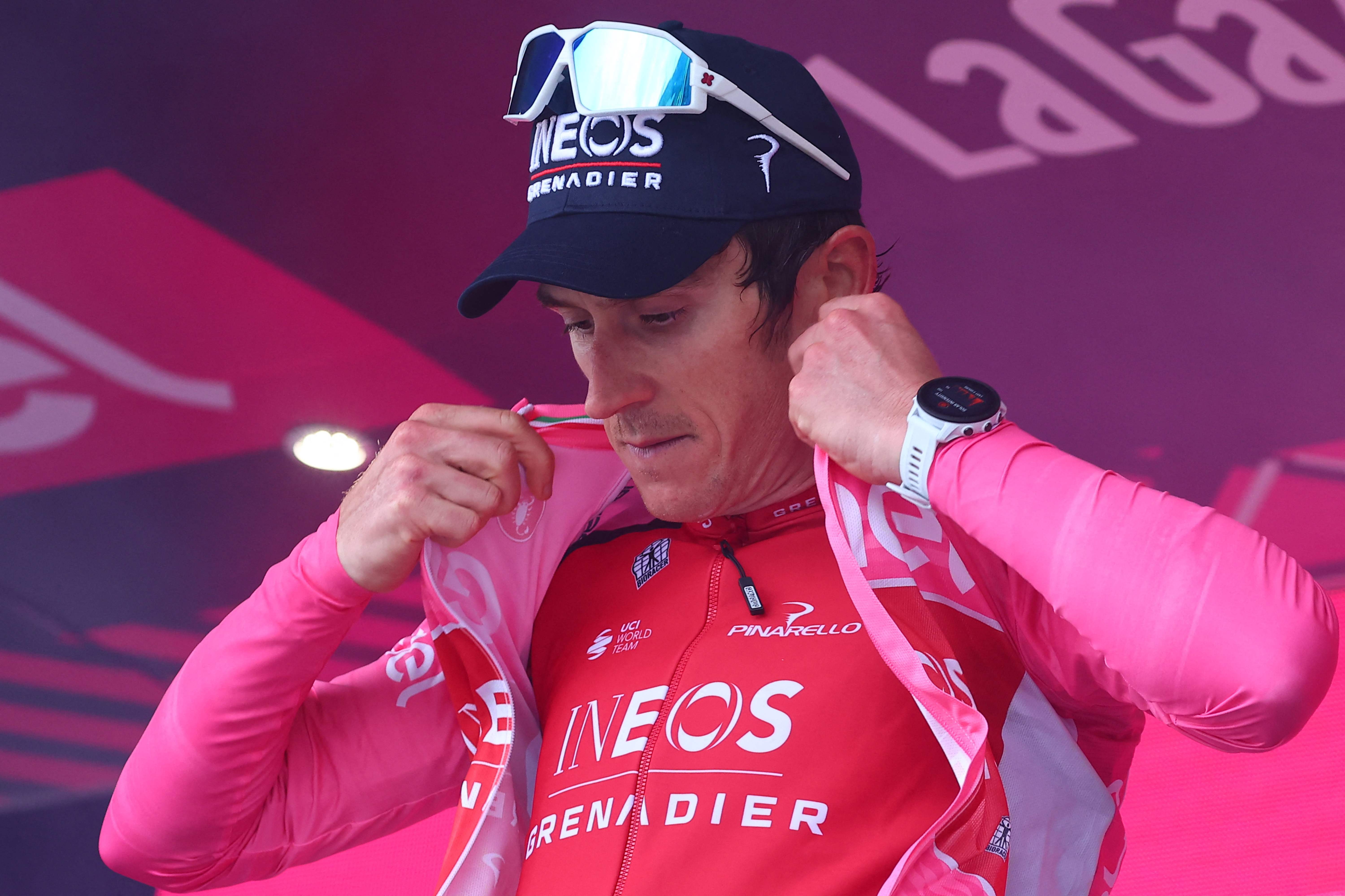 Geraint Thomas celebrates his overall leader's pink jersey on the podium