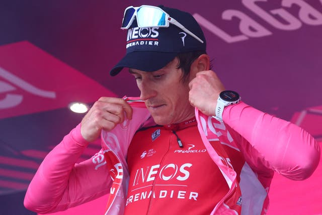 <p>Geraint Thomas celebrates his overall leader's pink jersey on the podium</p>