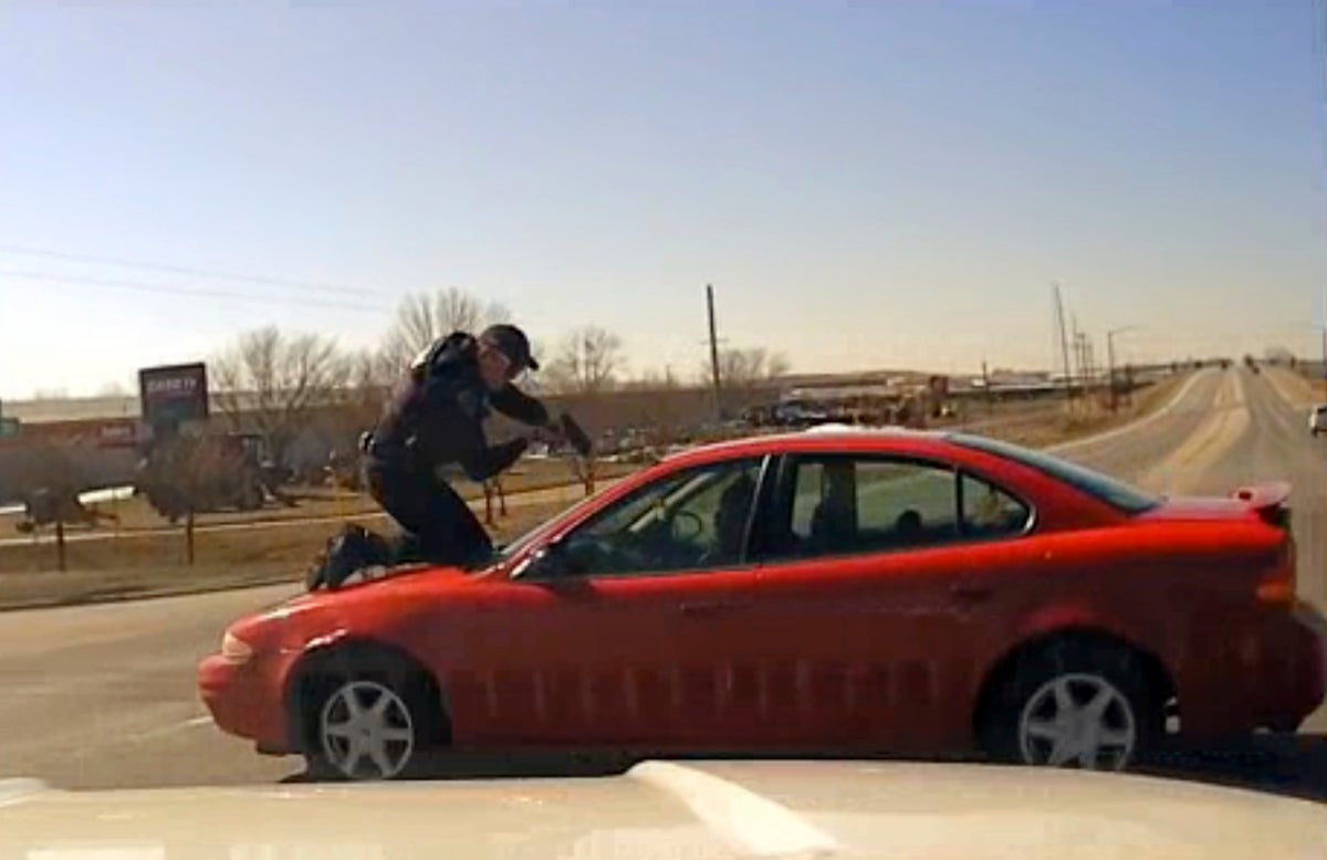 Video shows driver fleeing Iowa police with officer on top of the car