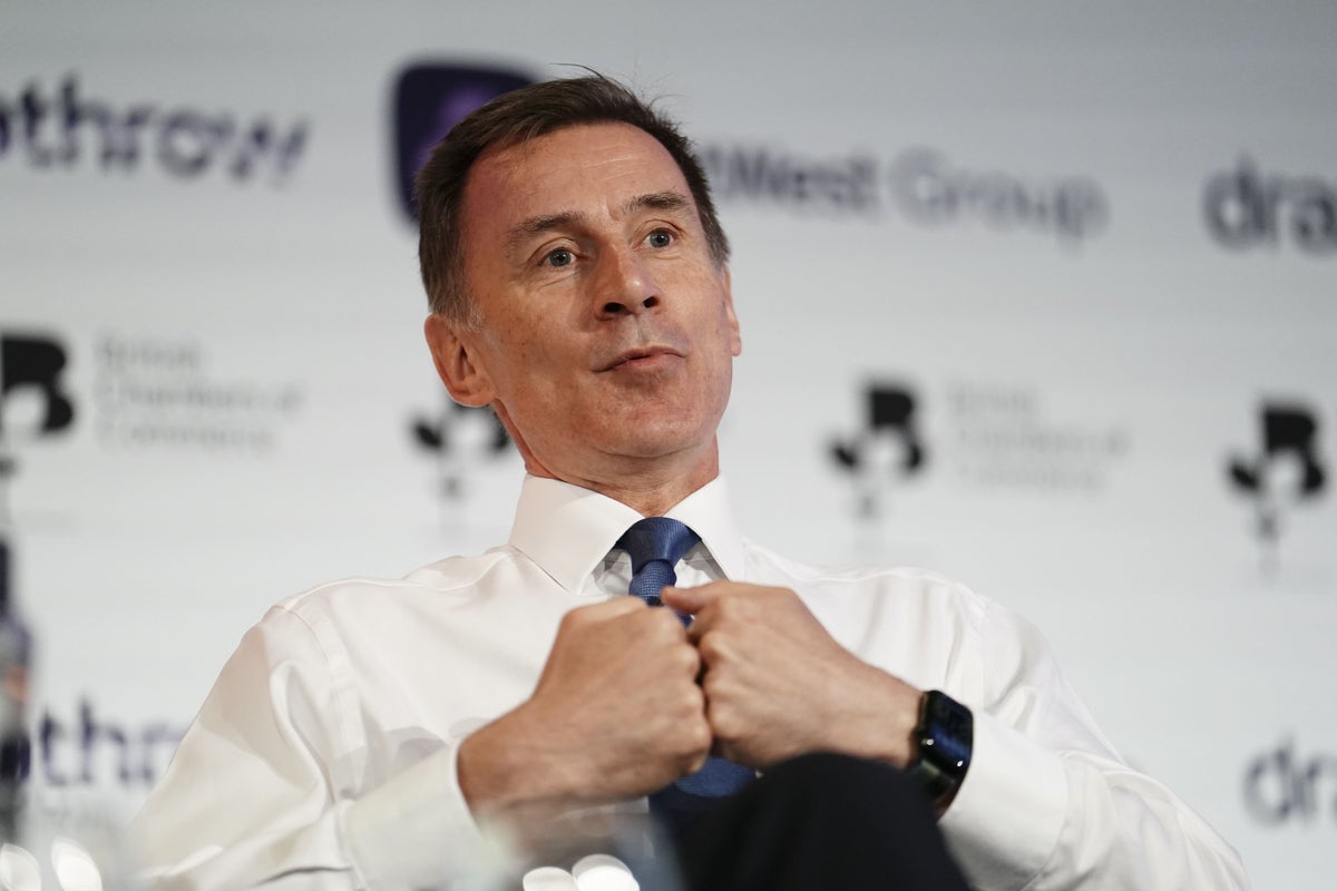 Hunt tells Tories not to talk the country down as he hints at tax cuts