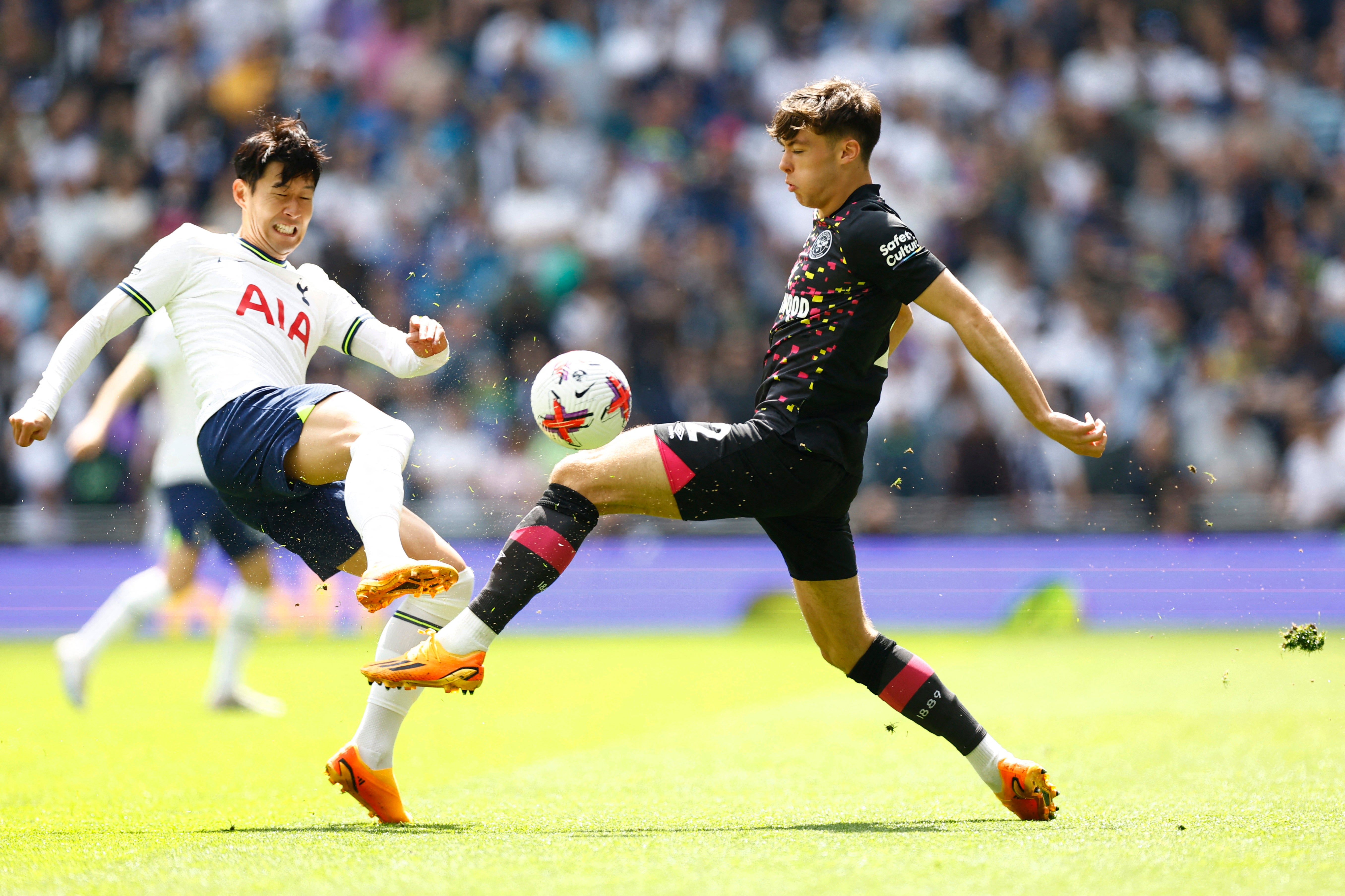 Son Heung-min challenges Aaron Hickey in midfield