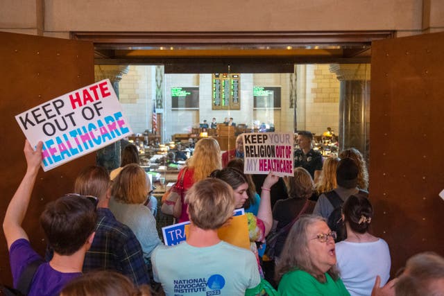 <p>Opponents to the Let Them Grow Act protest outside the door of the legislative chamber on May 16 at State Capitol in Lincoln, Nebraska </p>