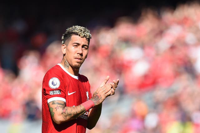 <p>Roberto Firmino applauds the Liverpool fans at full-time</p>