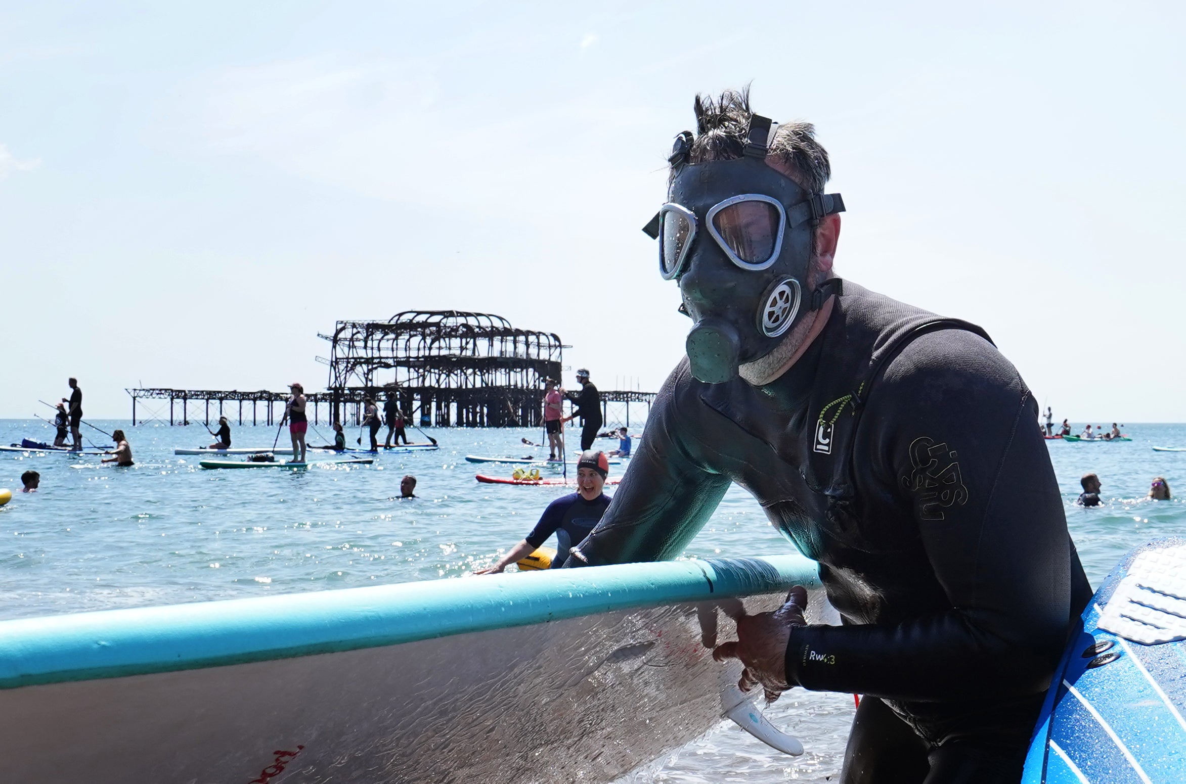 Protesters emerged from the sea at Brighton West Pier as Surfers Against Sewage held a UK-wide paddle-out protest against pollution earlier this year