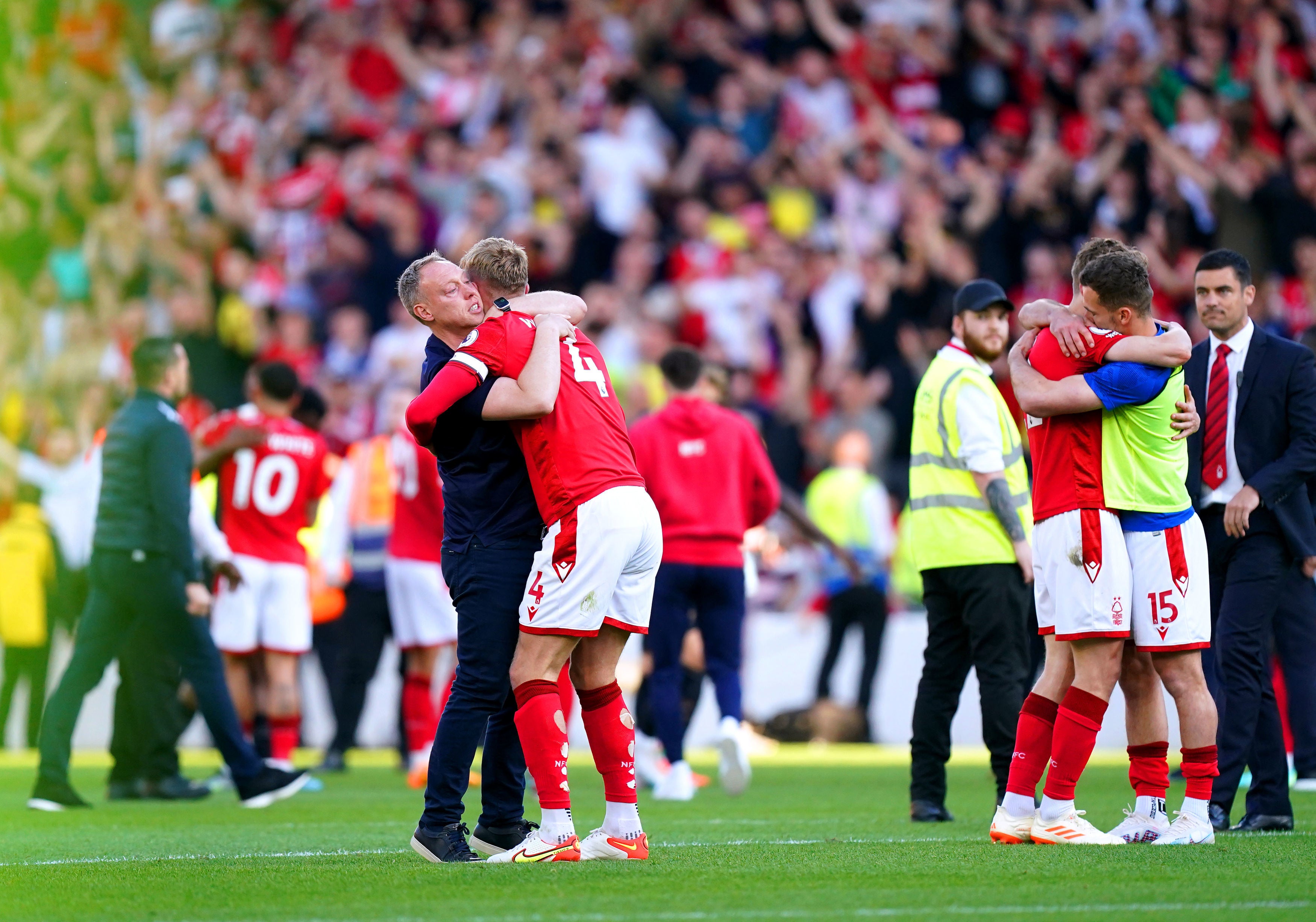 Nottingham Forest manager Steve Cooper hugs defender Joe Worrall