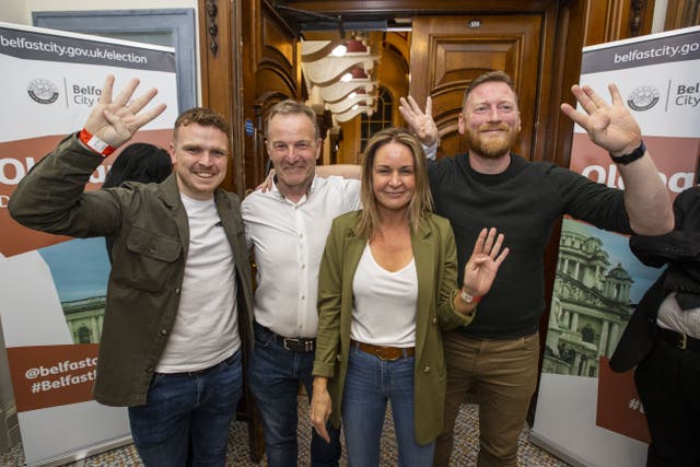(from left) Sinn Fein’s Ryan Murphy, JJ Magee, Nichola Bradley, and Tomas O Neill hold up four fingers after all four won seats in Oldpark at Belfast City Hall during the Northern Ireland council elections (Liam McBurney/PA)