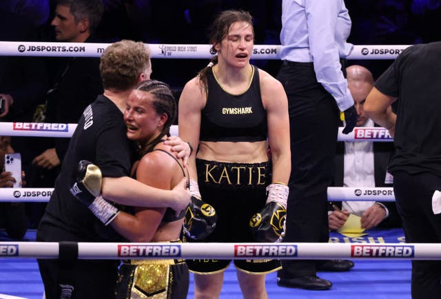 <p>A defeated Katie Taylor stands in disbelief after her title fight against Chantelle Cameron at the 3Arena in Dublin</p>