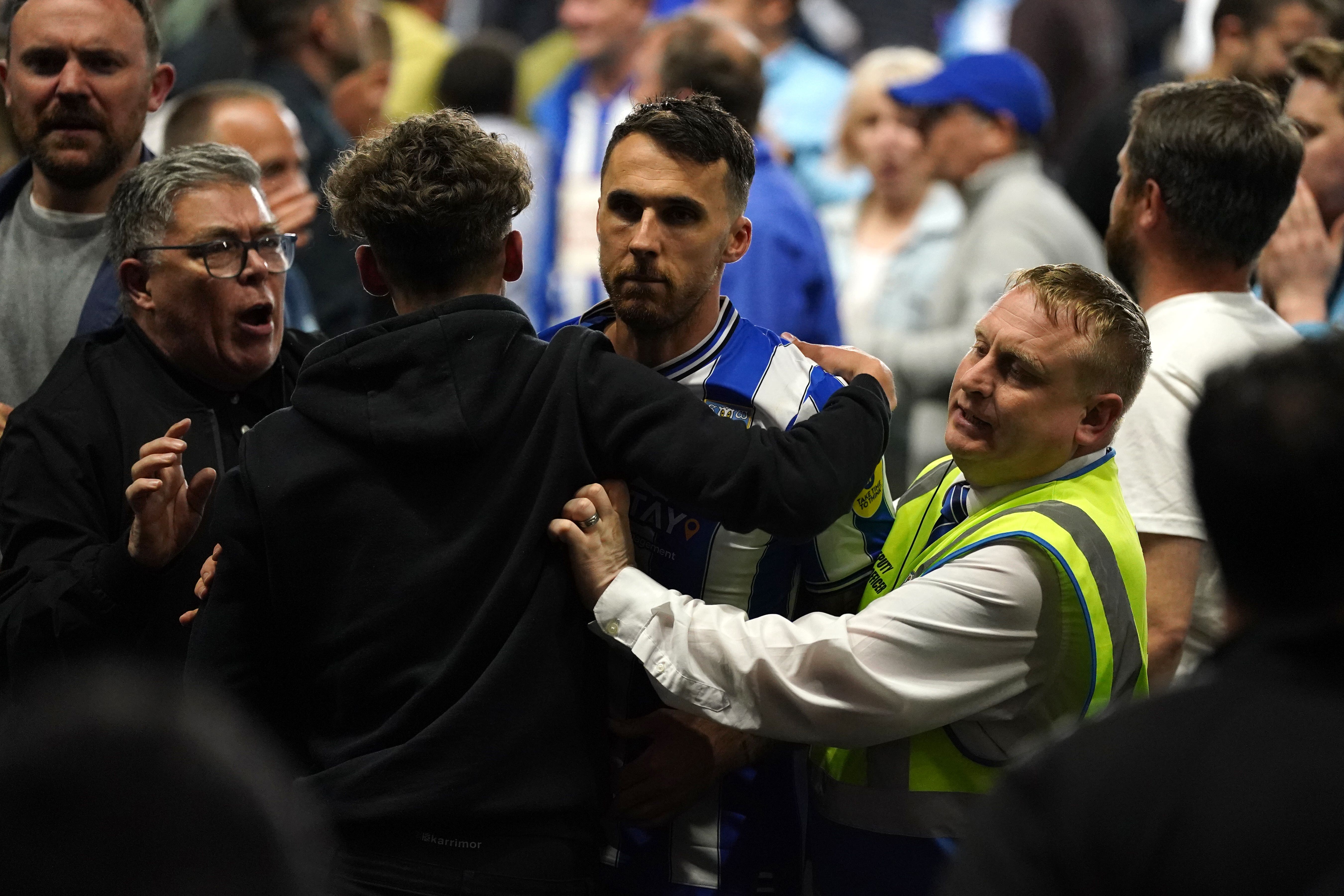 Lee Gregory was helped off the pitch after Sheffield Wednesday’s stunning win against Peterborough (Nick Potts/PA)