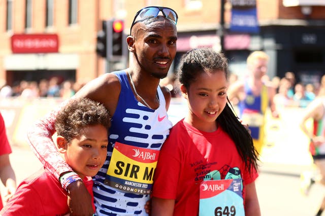 Sir Mo Farah with his children at the Great Manchester Run (Tim Markland/PA)