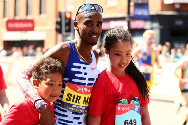 Sir Mo Farah with his children at the Great Manchester Run (Tim Markland/PA)
