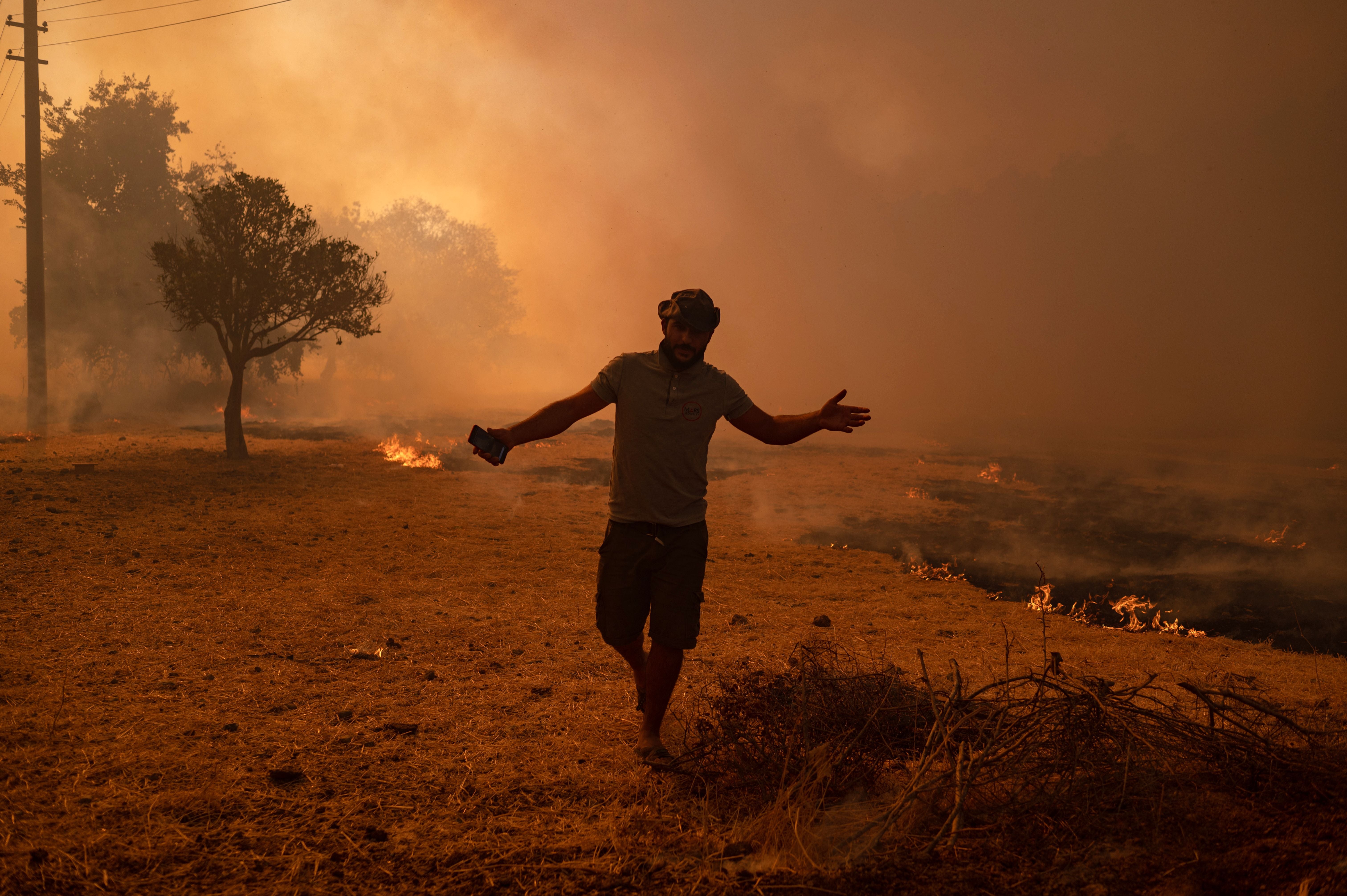 A man walks away from an advancing wildfire in Turkey in 2021, with Europe accounting for 8 per cent of reported deaths worldwide