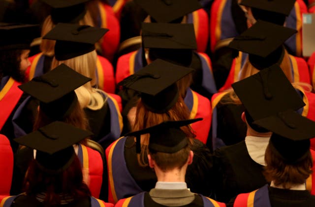 <p>Students in graduation gowns and caps (stock image) </p>