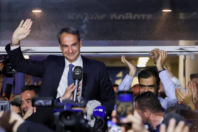 <p>Greek prime minister and New Democracy conservative party leader Kyriakos Mitsotakis waves outside the party's headquarters, after the general election, in Athens, Greece</p>