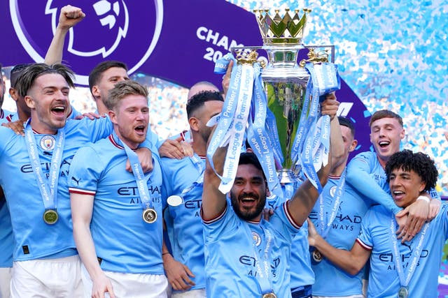 Ilkay Gundogan lifts the Premier League trophy after Manchester City secured the title (Martin Rickett/PA)