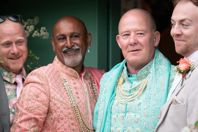 Clive Gillmor and Manoj Malde (both centre) take part in the first wedding ceremony to be held at the RHS Chelsea Flower Show (James Manning/PA)