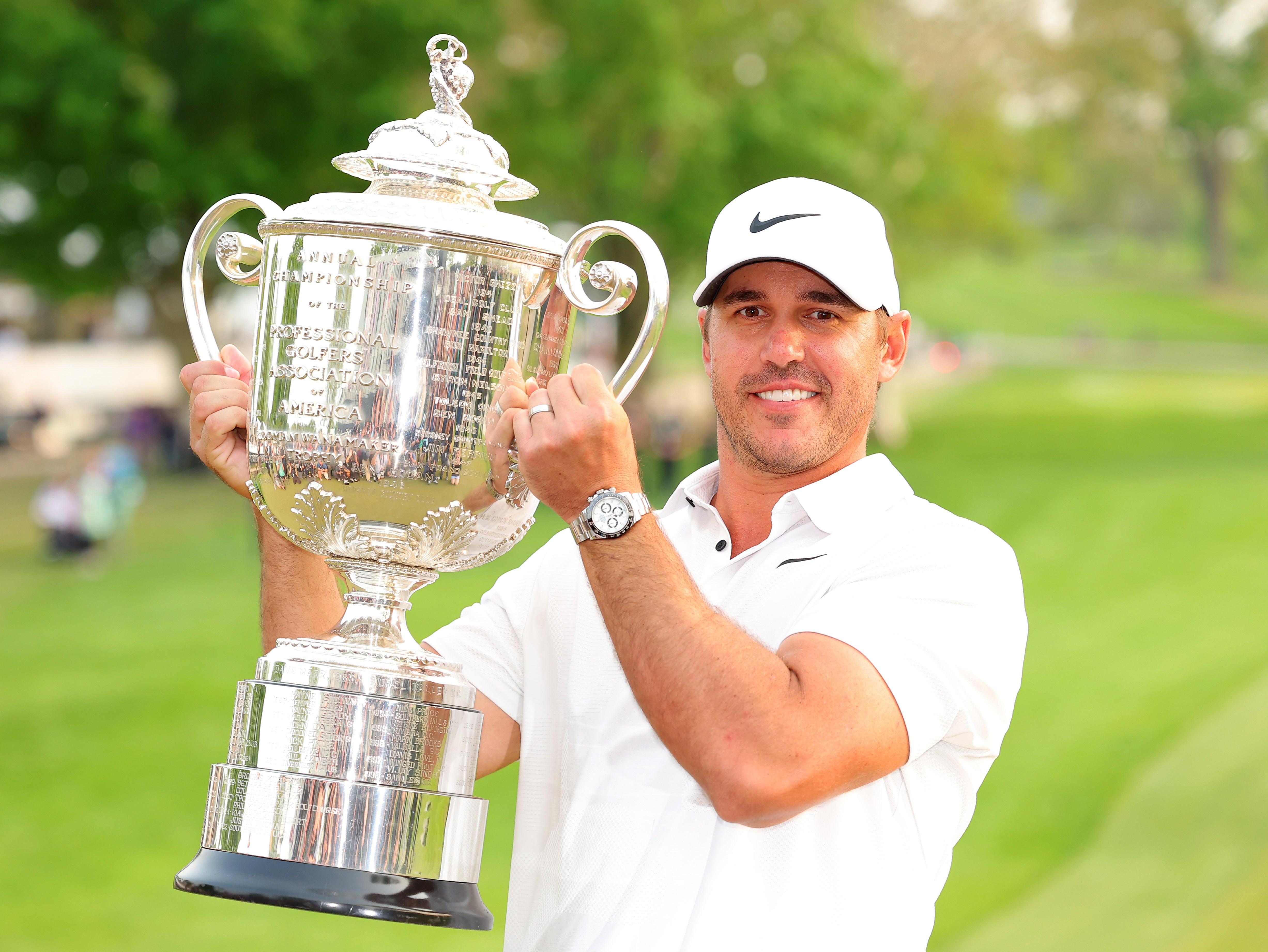 Brooks Koepka in Rochester, New York, on Sunday lifts the Wanamaker Trophy for a third time
