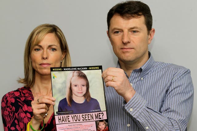 <p>Kate and Gerry McCann with a computer generated picture of Madeleine in 2012</p>
