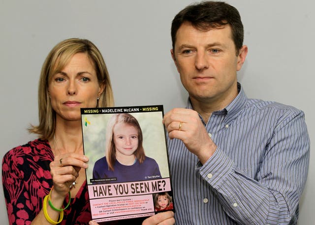 <p>Kate and Gerry McCann with a computer generated picture of Madeleine in 2012</p>