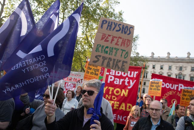 Protesters during the demonstration in Parliament Square, London (Lucy North/PA)