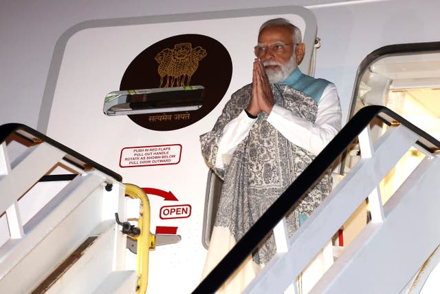 <p>India’s prime minister Narendra Modi gestures as he arrives at the Sydney international airport on Monday, 22 May 2023</p>