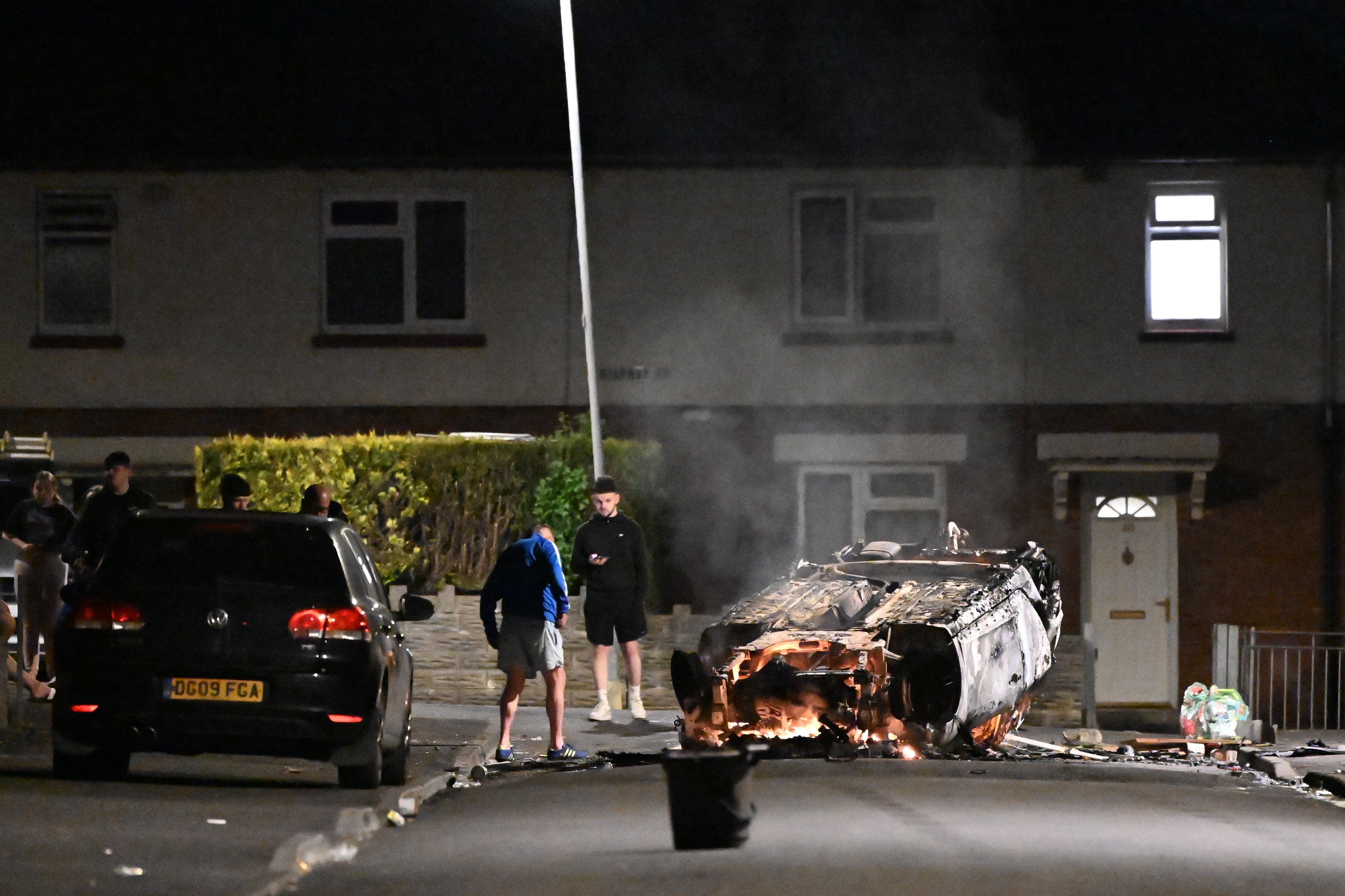 Fires have been started and missiles thrown at police after they attended a serious road traffic collision earlier in the evening