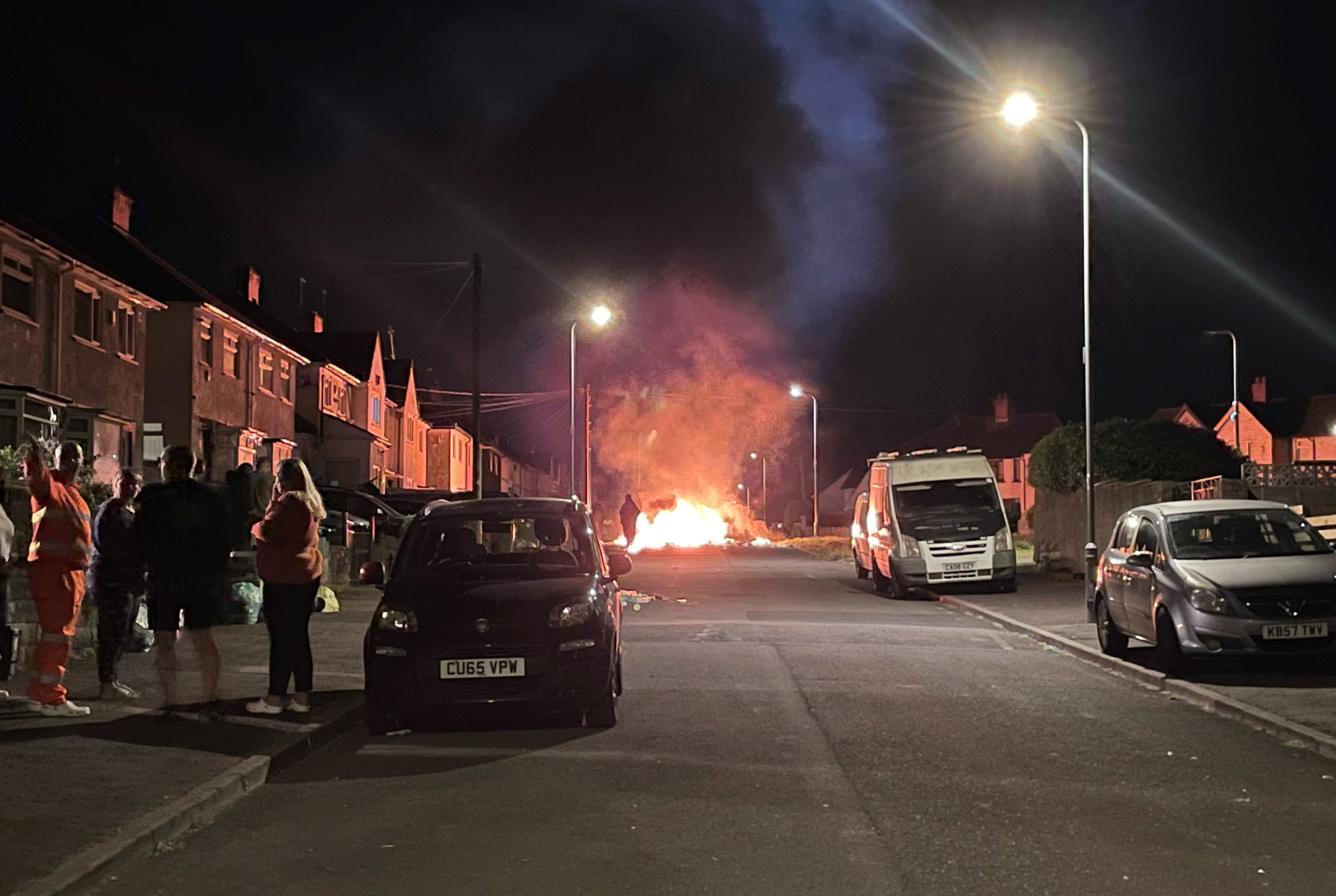 A number of vehicles in the area were torched by rioters