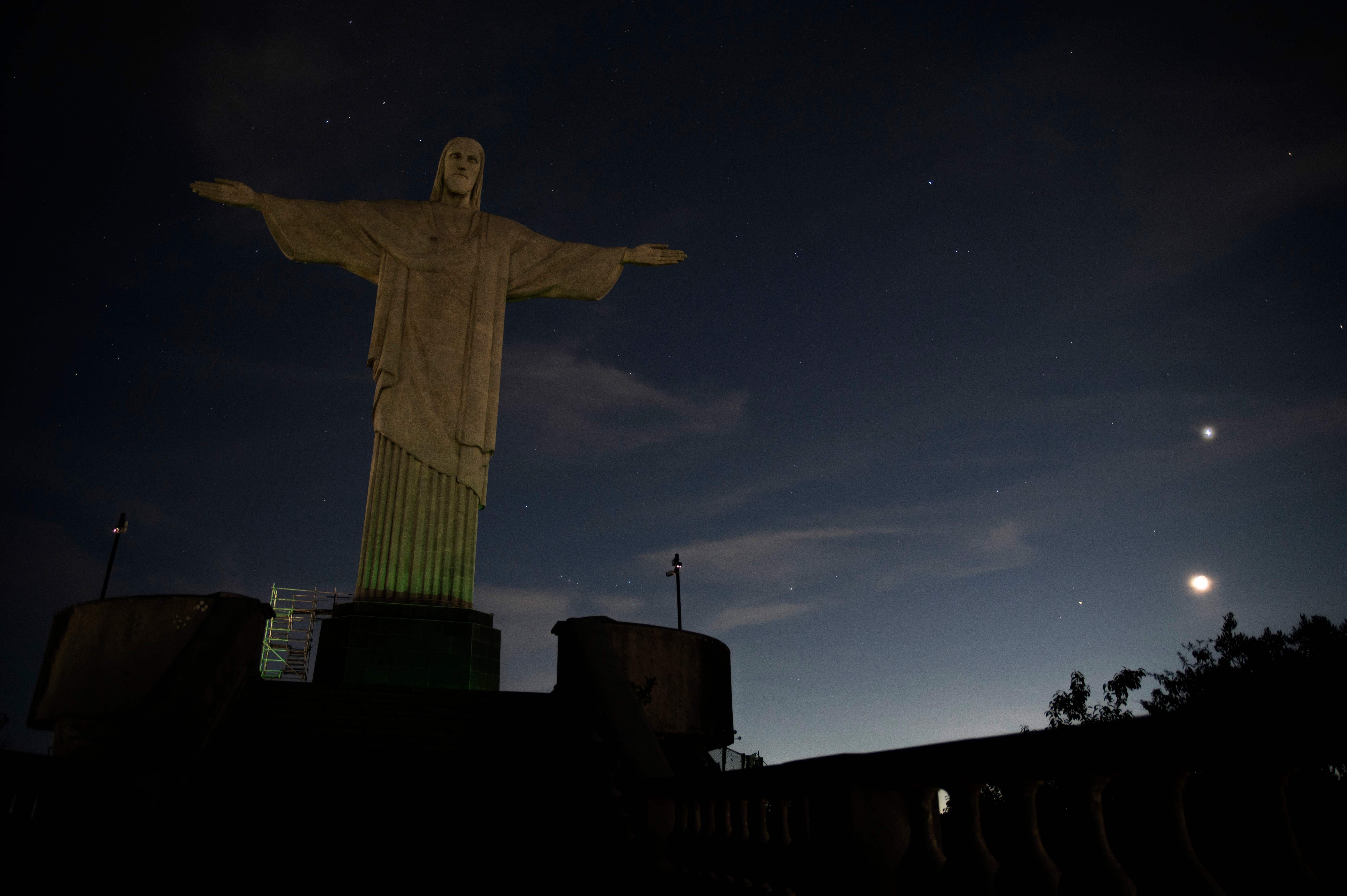 The Christ the Redeemer statue is seen without illumination to condemn racist acts against Brazilian footballer Vinicius Junior in Rio de Janeiro