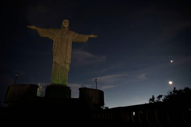 <p>The Christ the Redeemer statue is seen without illumination to condemn racist acts against Brazilian footballer Vinicius Junior in Rio de Janeiro</p>