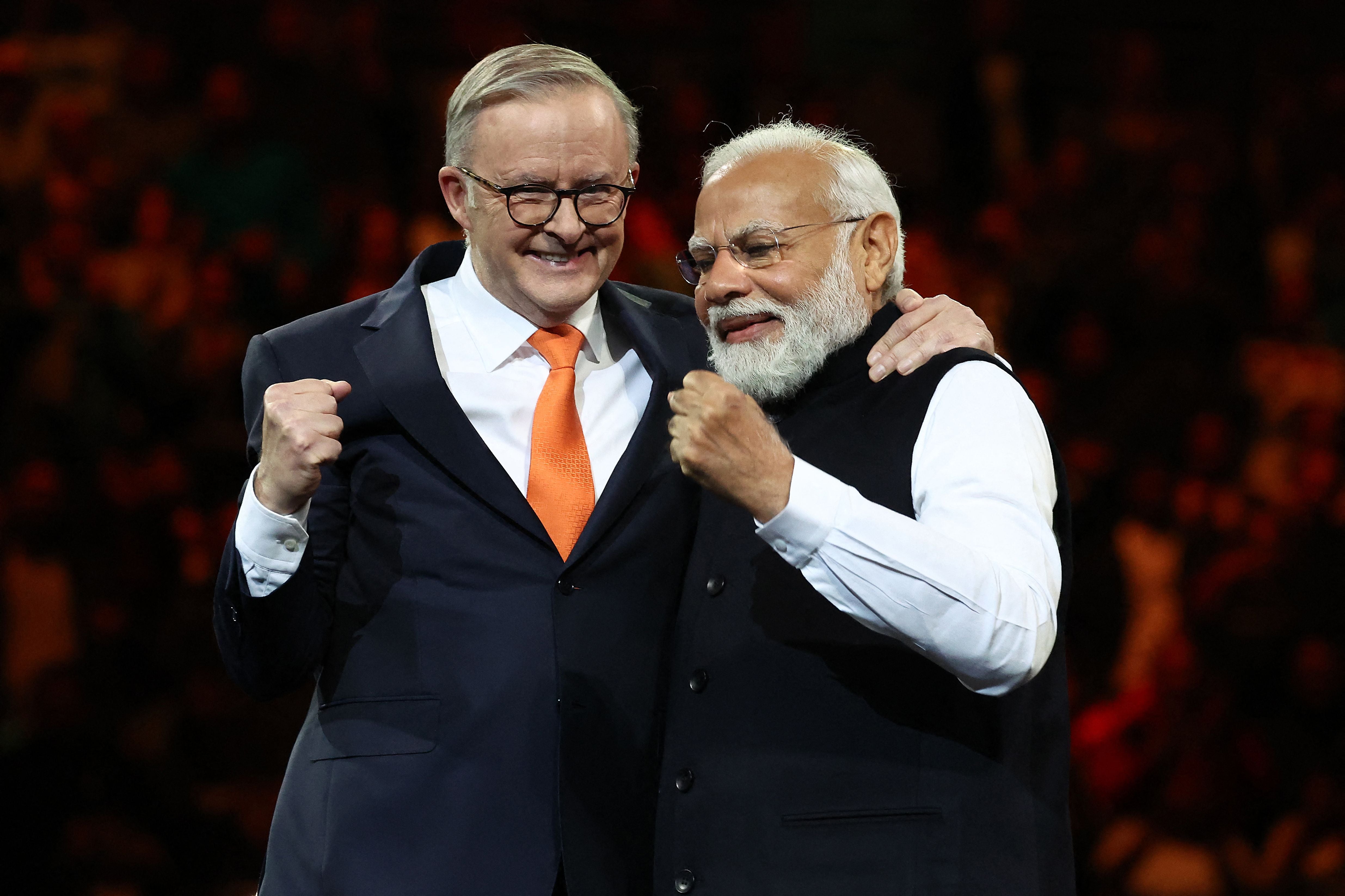 India’s prime minister Narendra Modi and Australia’s prime minister Anthony Albanese gesture during an event with members of the local Indian community at the Qudos Arena in Sydney