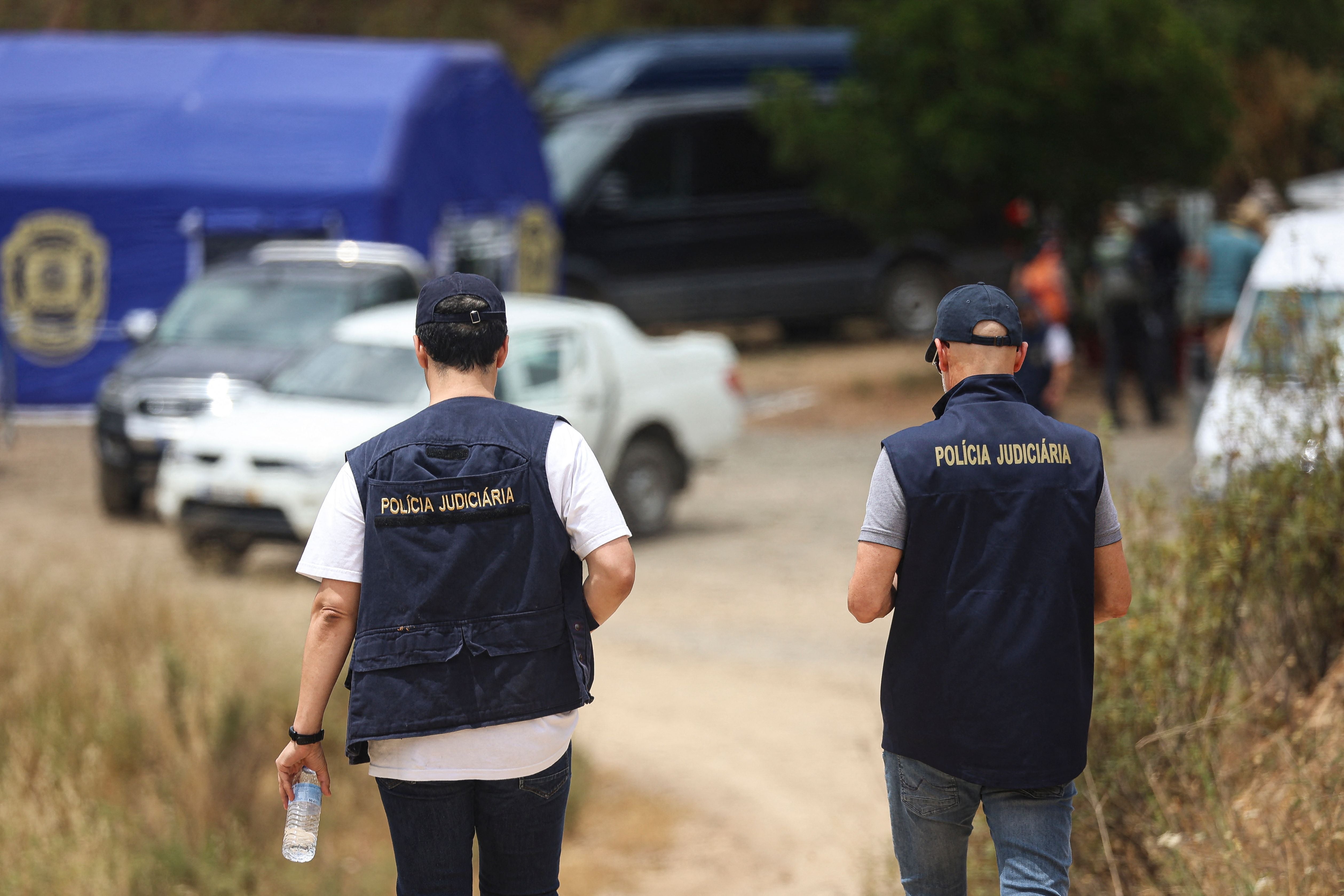 Policia Judiciaria officers at the search site