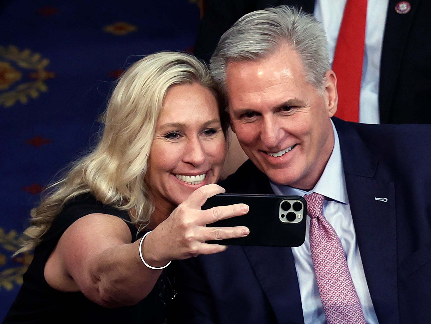 Marjorie Taylor Greene takes a photo with Kevin McCarthy after he was elected Speaker of the House in February