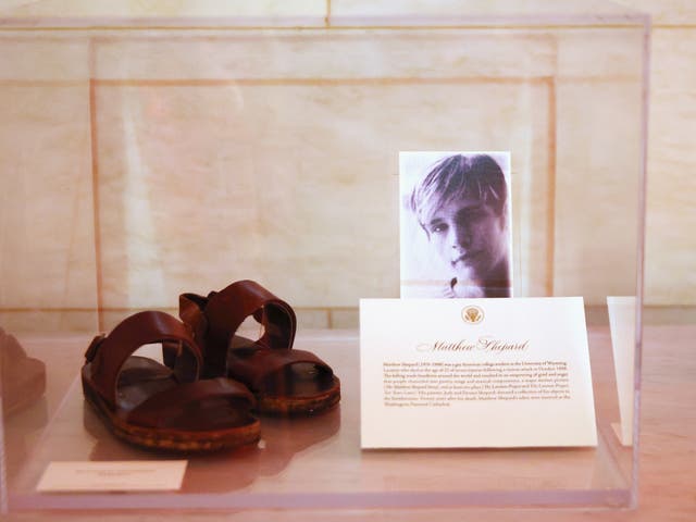 <p>A pair of Matthew Shepard’s sandals are displayed at the White House as part of the commemoration of LGBTQ+ Pride Month on June 25, 2021 in Washington</p>