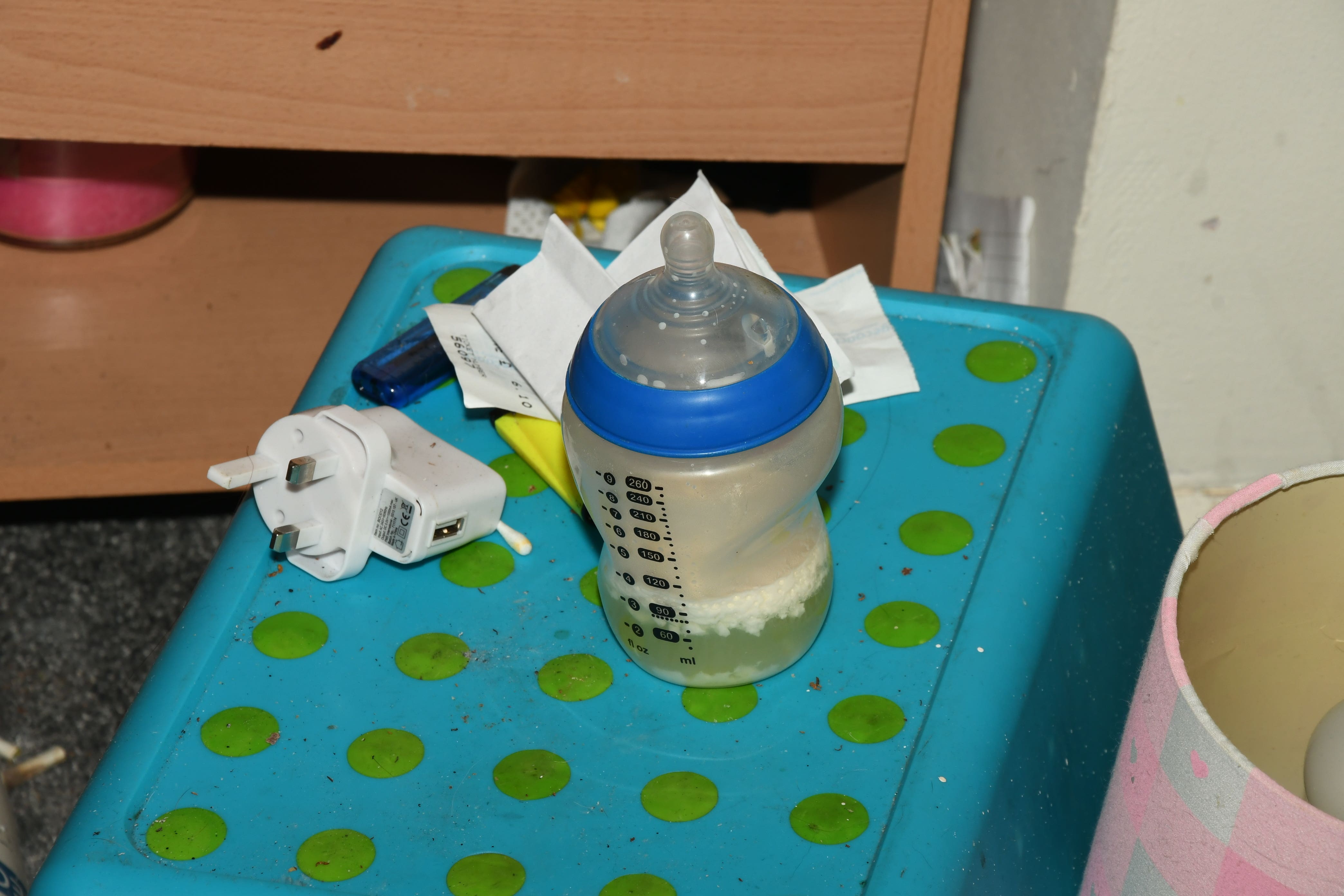 A baby bottle containing gone-off milk found by police (Derbyshire Police/PA)