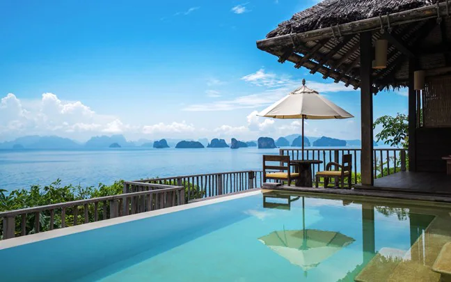 Relax in a villa pool with panoramic views of Phang Nga Bay