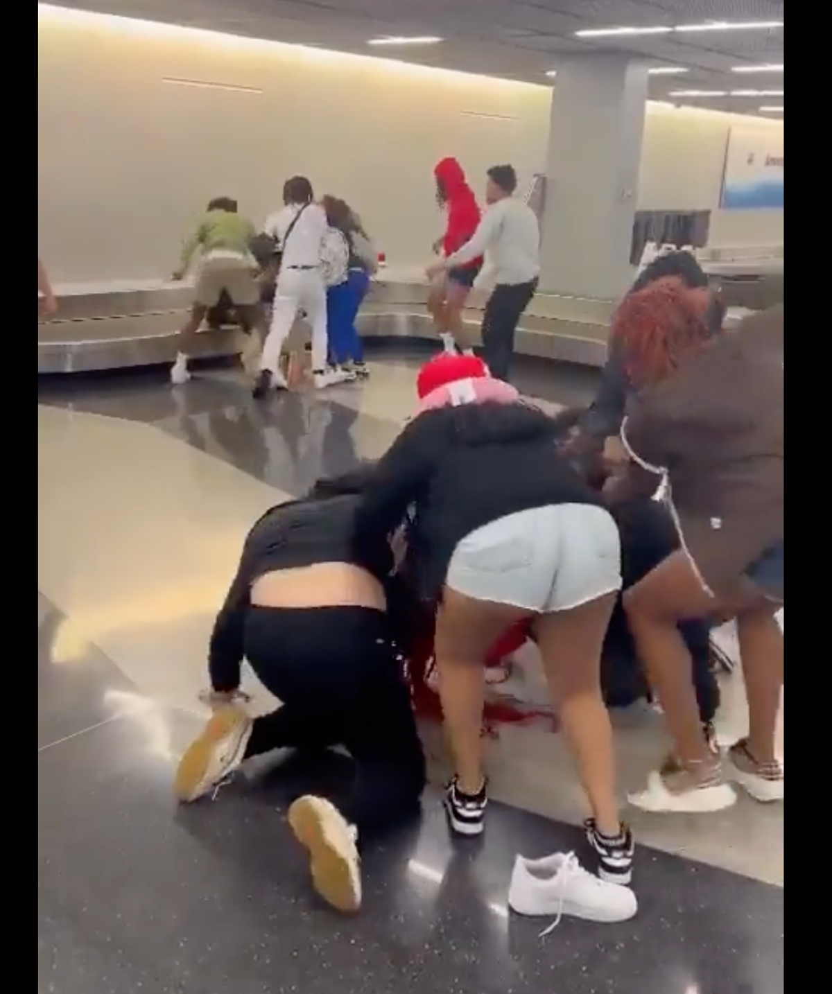 Two arrested over Chicago airport fight as video goes viral