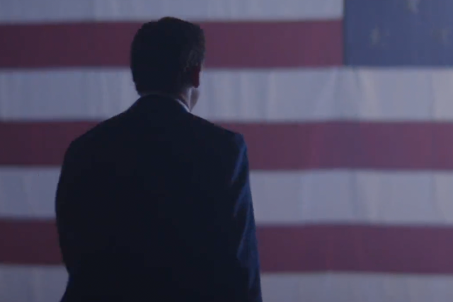 <p>Gov Ron DeSantis of Florida walks toward a US flag in a campaign video</p>