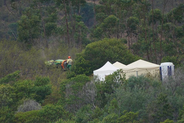 <p>Personnel clear undergrowth with machinery at Barragem do Arade reservoir, in the Algave, Portugal, as searches continue as part of the investigation into the disappearance of Madeleine McCann (Yui Mok/PA)</p>
